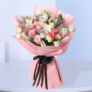 pink roses, white orchids, and lisianthus, wrapped in pink paper- perfect for birthdays