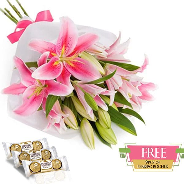 Treasured Pink Lilies Hand bouquet of pink lilies tied with a pink ribbon, with 9 FREE Ferrero Rocher chocolates.