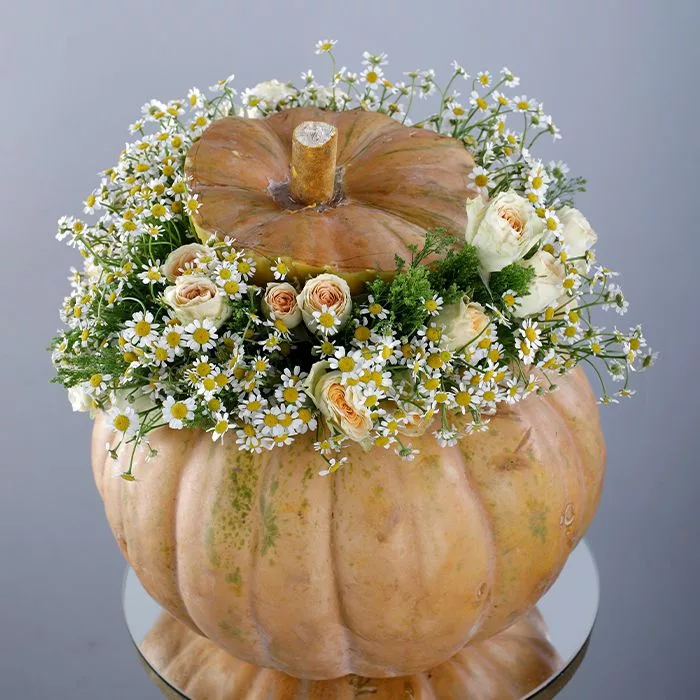 cheerful spray rose in pumpkin arrangement jpg