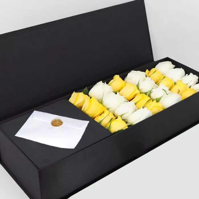 white yellow roses in black box jpg