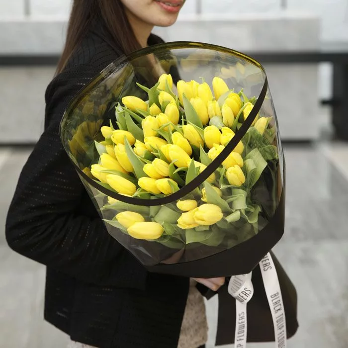 yellow tulips in black wrap jpg