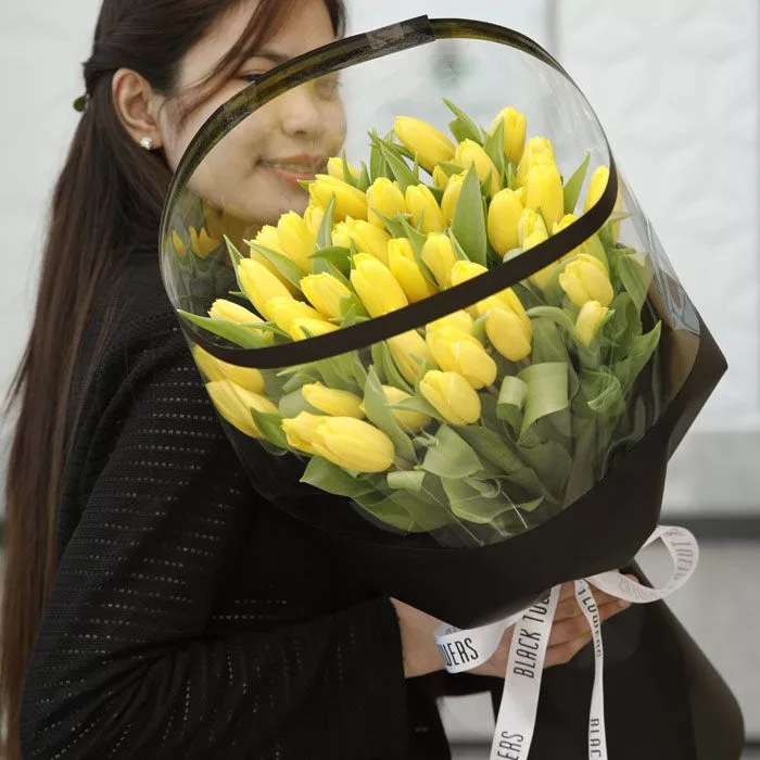 yellow tulips in black wrap 2 jpg