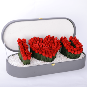 "I ❤️ U" arrangement featuring delicate baby roses, stylish steel grass, and elegant white stones, all beautifully presented in a charming box.