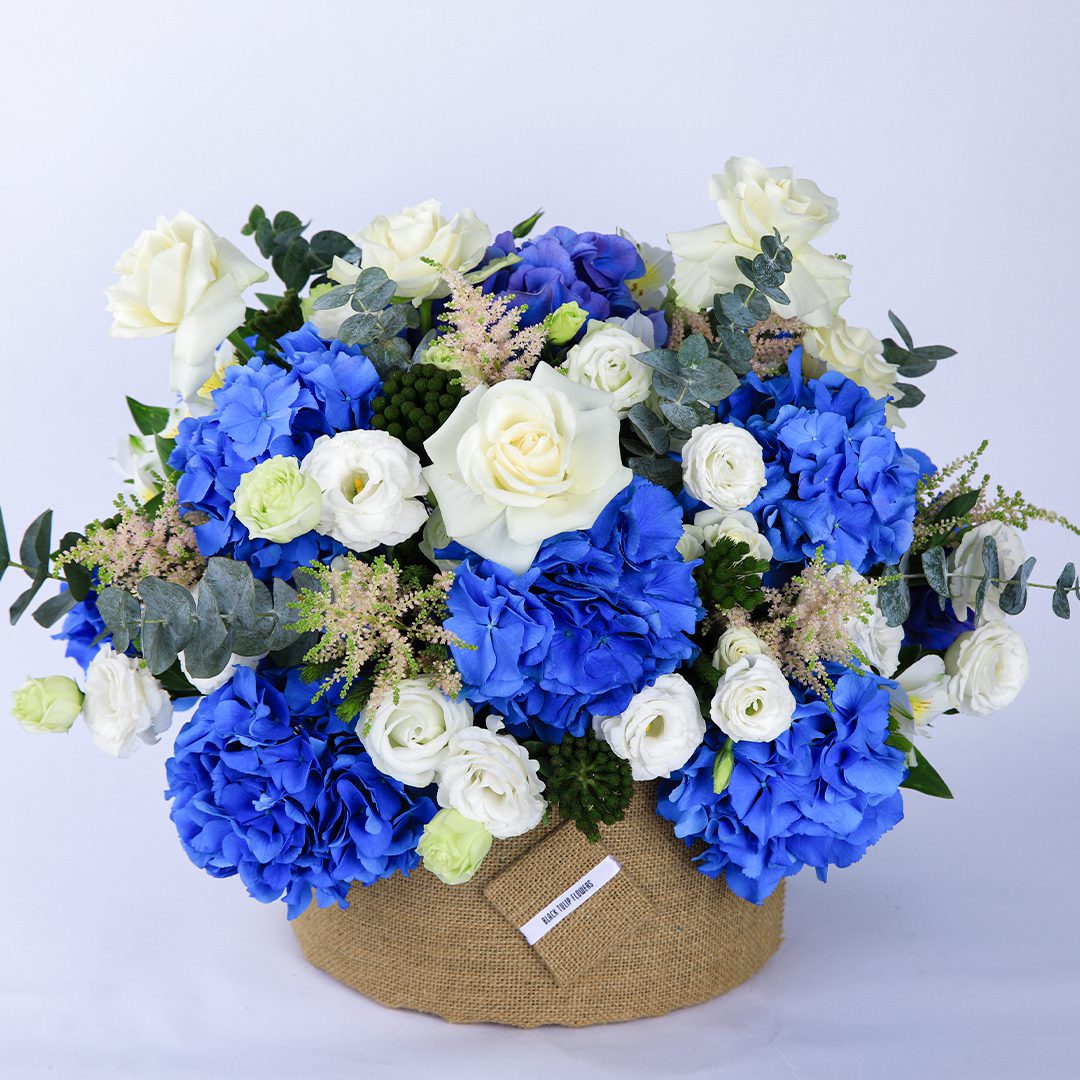 Azure and Ivory flower box by Black Tulip Flowers.