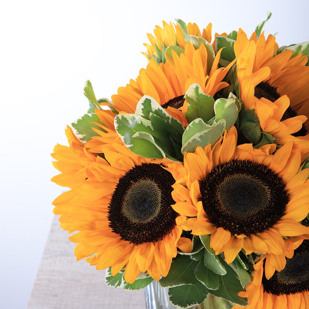 Shining Centerpiece with sunflowers by Black Tulip Flowers