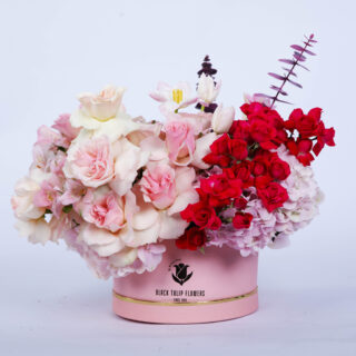 Flower Delivery Abu Dhabi 49 A beautiful "Pink Box" filled with light pink roses, dark pink spray roses, pink tulips, pink hydrangeas, and eucalyptus.