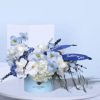 A bouquet of blue and white flowers for Father's Day.
