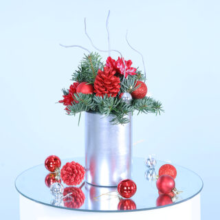 Frosted Silver Wonderland Vase filled with festive florals, pine cones, and ferns, exuding elegance and holiday charm.