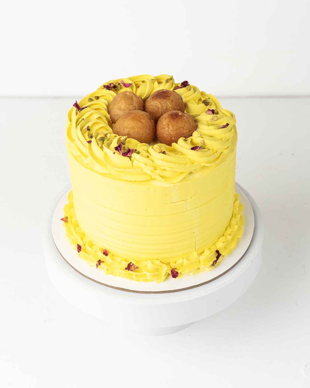 1kg Diwali-themed Gulab Jamun cake in vanilla flavour with yellow colouring.