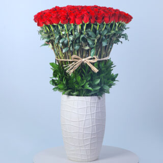 Indulge in pure romance with this extravagant arrangement of 100 red roses. The ultimate expression of love and affection