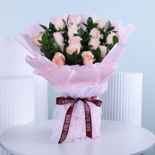 Freshly picked peach roses, carefully arranged to brighten any celebration or heartfelt moment.