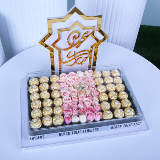 Eid gift box with sweet revival roses and chocolates arranged in a large tray.