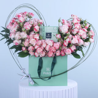 Romantic heart-shaped pink spray roses with chocolates, an ideal gift for you iron lady.