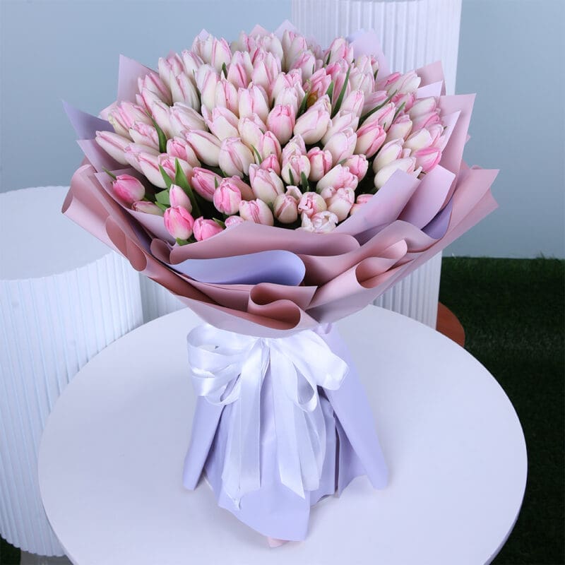 pink-tulip-bouquet Pink tulips bouquet, wrapped in light purple and tied with a white satin bow.
