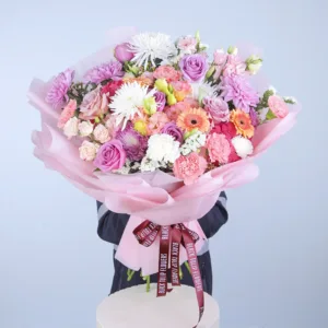 Let your senses dance with the beauty of luscious pink hydrangea stems paired with a lively mix of assorted pastel flowers. This bouquet is a floral ballet, where each bloom plays its part in creating a stunning visual performance. 2 stem of pink hydrangea 20 stem of mix flowers