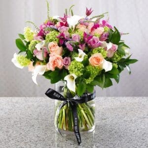 Capturing excellence of floral vibes that would give a positive mood. This flower arrangement composed with mix of fresh flowers in a glass vase.