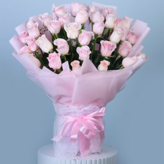 Flower Delivery Abu Dhabi 42 A beautiful bouquet of soft pink roses wrapped in pink and tied with a pink lace ribbon.