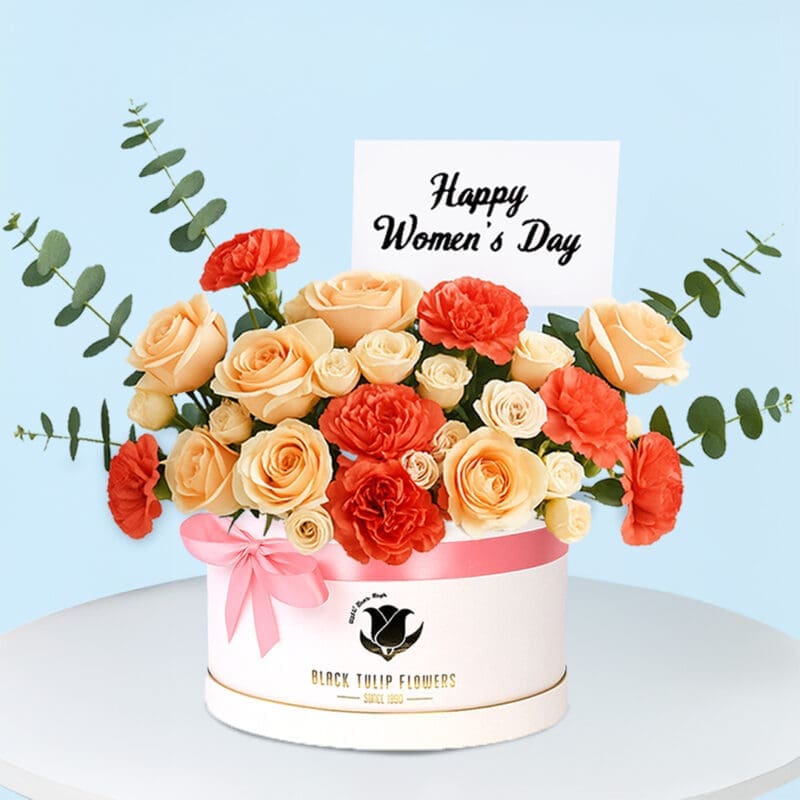 A beautifully wrapped gift box adorned with a "Happy Women's Day" tag, surrounded by flowers and decorative elements.