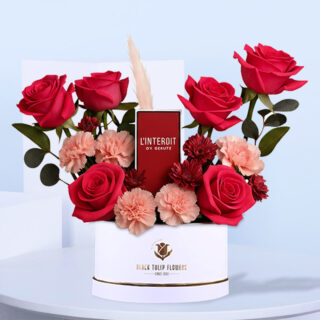 Givenchy L’Interdit Rouge EDP Women 80ML in a White flower box filled with pink roses and small red mums.