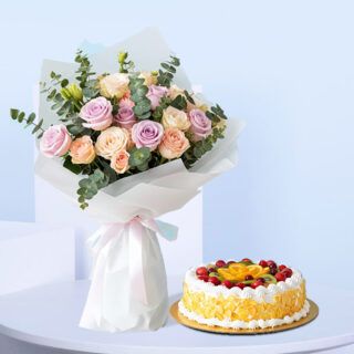 Flower Delivery Abu Dhabi 25 A bouquet of pastel pink, lavender, and peach roses, with green eucalyptus, wrapped in white with a light pink and blue ribbon. A round fresh fruit cake, decorated with whipped cream and colorful fruits.