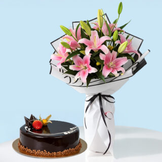 Flower Delivery Abu Dhabi 27 A combo gift set featuring a bouquet of pink lilies wrapped in black and white with a black ribbon. A glossy chocolate truffle cake garnished with a fresh strawberry and a physalis berry.