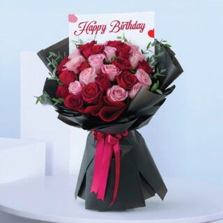 Birthday bouquet of 30 roses, 15 red and 15 light pink with fresh greenery, sleek black wrap with a message card "Happy Birthday"