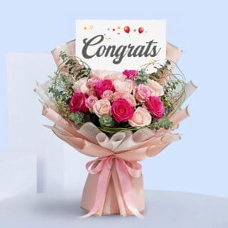 BTF Home 42 Pink roses congratulations bouquet with eucalyptus in blush pink wrap, tied with a satin ribbon and a “Congrats” card.