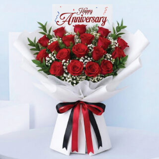 Happy Anniversary bouquet with 18 red roses, white fillers, and elegant white wrapping.