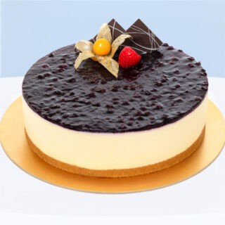 Blueberry Mousse Cheesecake with cookie base and jam topping.