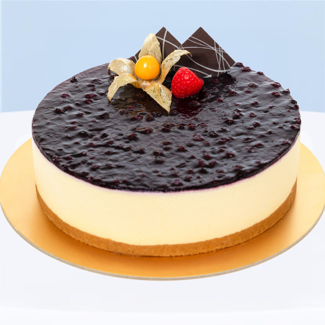 blueberry-cheese-cake Blueberry Mousse Cheesecake with cookie base and jam topping.