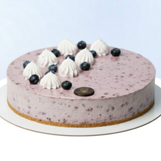 Blueberry Cheesecake 1Kg by Mister Baker topped with blueberries and cream.