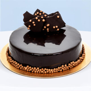 Chocolate Fudge Cake with rich ganache and glossy dark chocolate glaze.