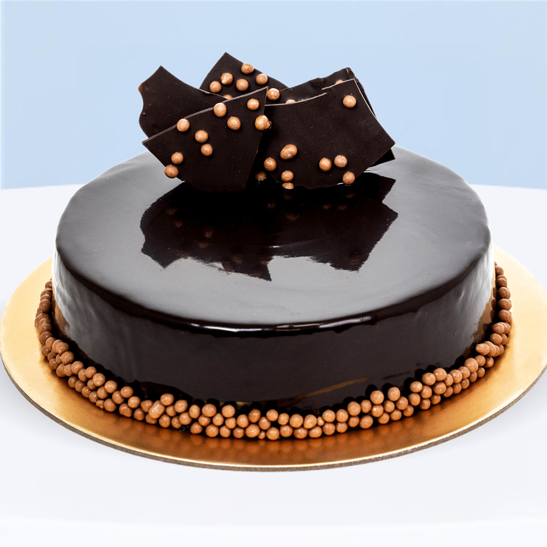 dark-chocolate-cake Chocolate Fudge Cake with rich ganache and glossy dark chocolate glaze.