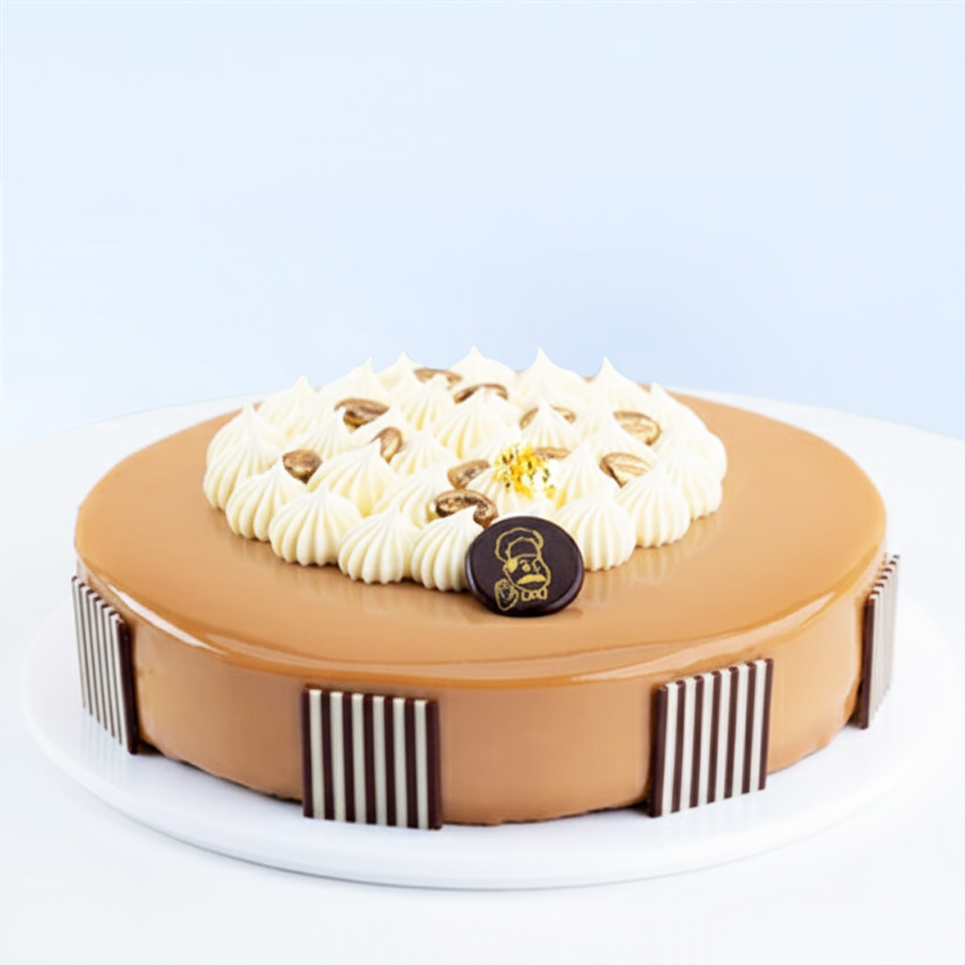 mocha-bean-cake Mocha Bean Cake 1 Kg by Mister Baker topped with cream swirls and chocolate decorations