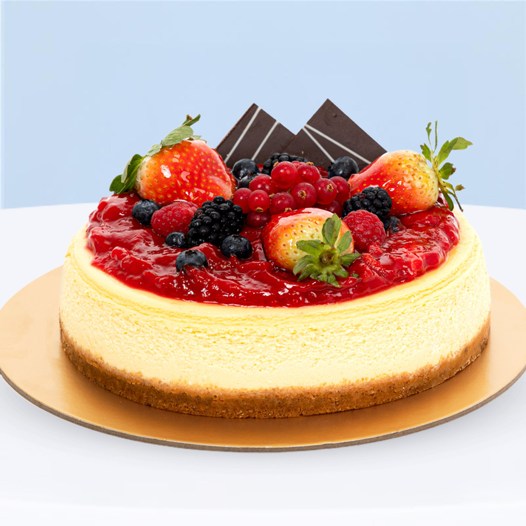 strawberry-baked-celebration-cheesecake Baked Strawberry Cheesecake with golden crust and glossy strawberry topping.