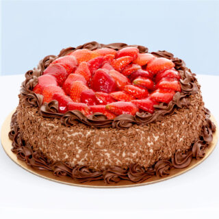 Strawberry Chocolate Cake topped with fresh strawberries and chocolate cream.