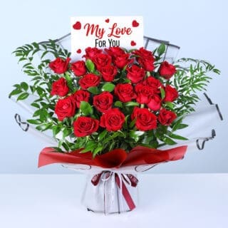 25 red roses and lush greenery in red wrapping, finished with a message card.