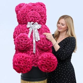 BTF Home 57 Pink spray roses in a teddy arrangement style, finished with a white ribbon.