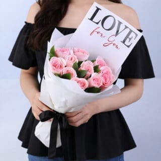 Flower Not Found 21 Pink roses and greenery in elegant white wrapping, finished with a "LOVE For You" message card.