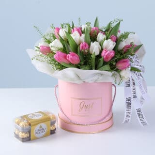 White tulips, pink tulips, lepidium in a premium pink box style, paired with 16 pieces of Ferrero Rocher chocolates.