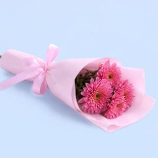 Single purple deco chrysanthemum bouquet beautifully wrapped in decorative paper, perfect for cheerful and thoughtful gifting