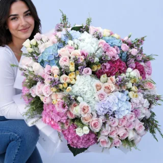 BTF Home 108 Handcrafted bouquet with soft-colored blooms and textured petals arranged in a refined presentation.