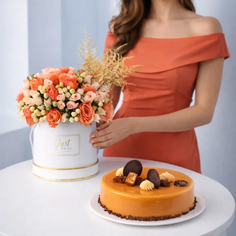 snickers-cake-rose-flower-box A peach rose birthday flower box with a cake placed beside as a gift combo.