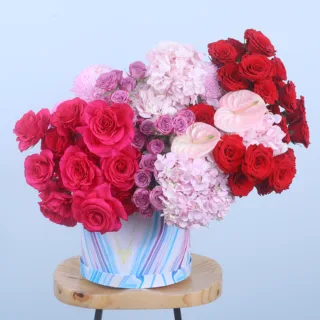 BTF Home 39 Exquisite Floral Hat Box featuring red roses, dark pink roses, light pink hydrangeas, purple spray roses, anthuriums, and light pink Deco chrysanthemum beautifully arranged in a premium hat box.