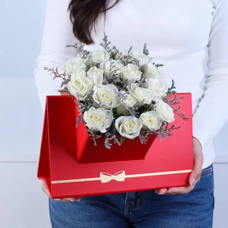 white-spray-rose-floral-envelope-box White Spray Rose Floral Envelope Box featuring 6 stems of fresh white spray roses with delicate caspia arranged in a premium red floral envelope box.