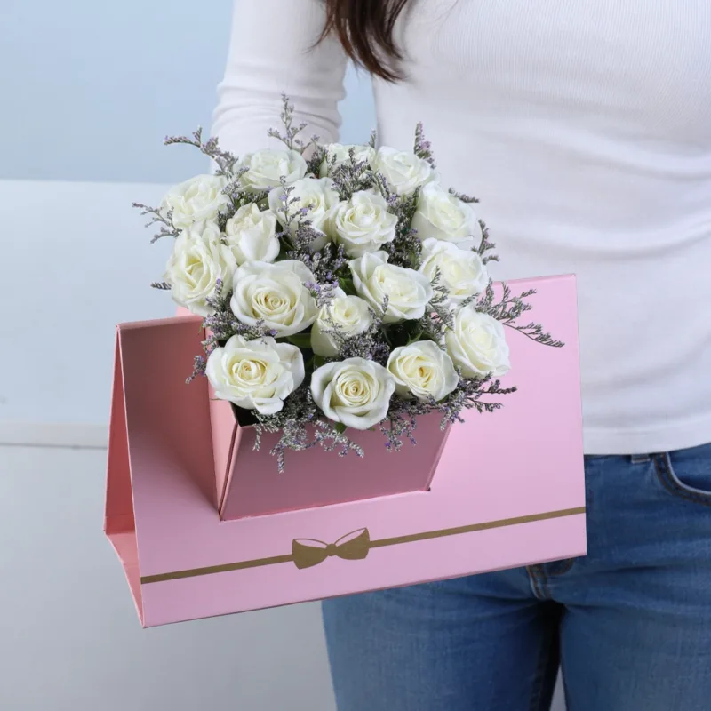 white-spray-rose-pink-envelope-box White Spray Rose Pink Envelope Box featuring 6 stems of fresh white spray roses with delicate caspia arranged in a premium pink envelope-style flower box.