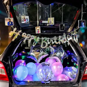Car Birthday Surprise Several photographs are hanging from strings attached to the top of the open boot, adding a personal touch.