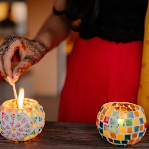 Custom Candle Jars shows three small, round candle jars made of colorful mosaic tiles